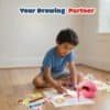 Child drawing with Petra Play interactive drawing robot and learning cards for creative play.