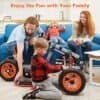 Family enjoying playtime with kids and a toy car in living room.