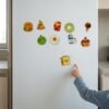 Food Magnets: a child placing a piece Food Magnets: a child placing a piece