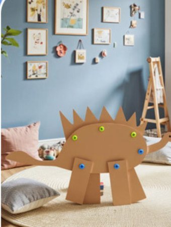 Cardboard stegosaurus built with the kit