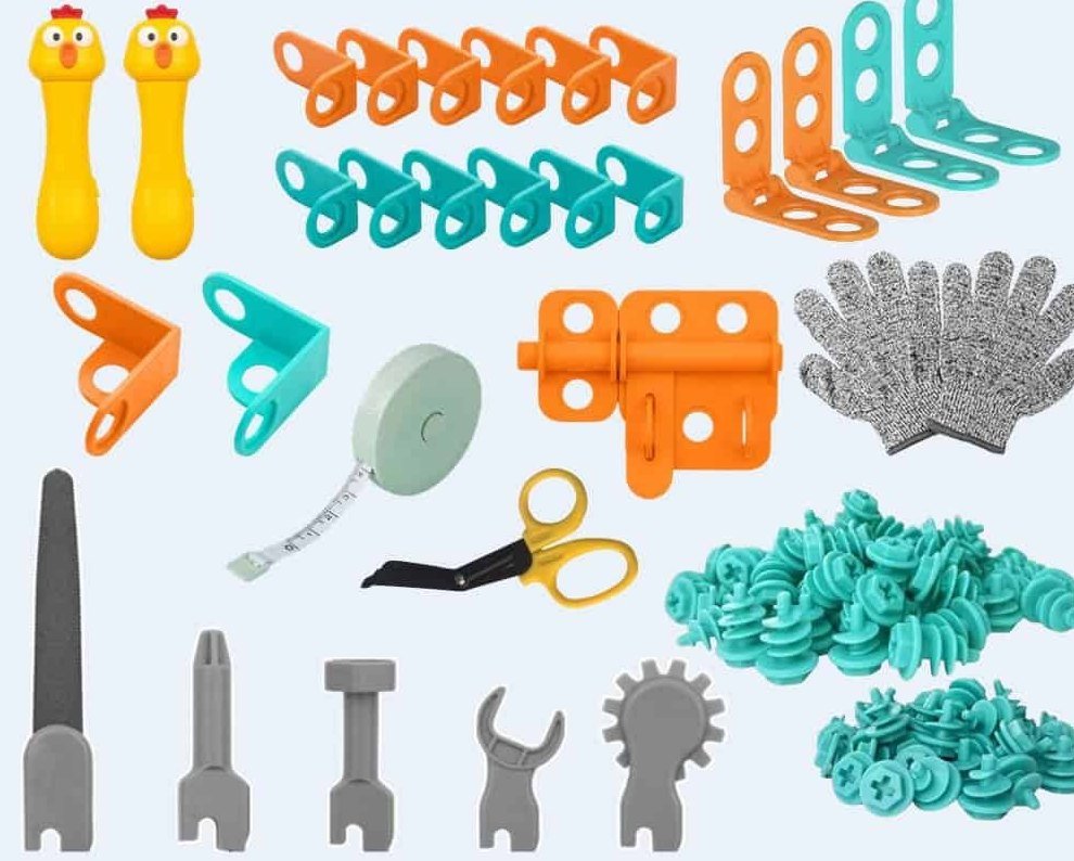 All the pieces of the kit laid out: handles, tool heads, screws, hinges, connectors, scissors, tape measure and gloves