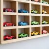 Wooden Toy Car Wall Shelf, 50 Spots: Personalised: detail Close-up of toy cars parked in the shelf slots