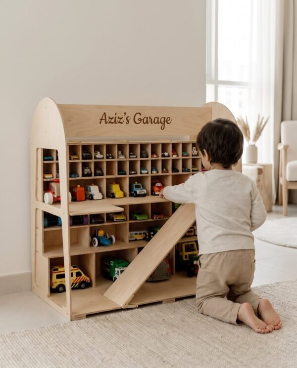 The wooden toy car garage at home with toy cars parked inside